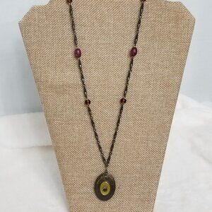 Express Brass tone locket.